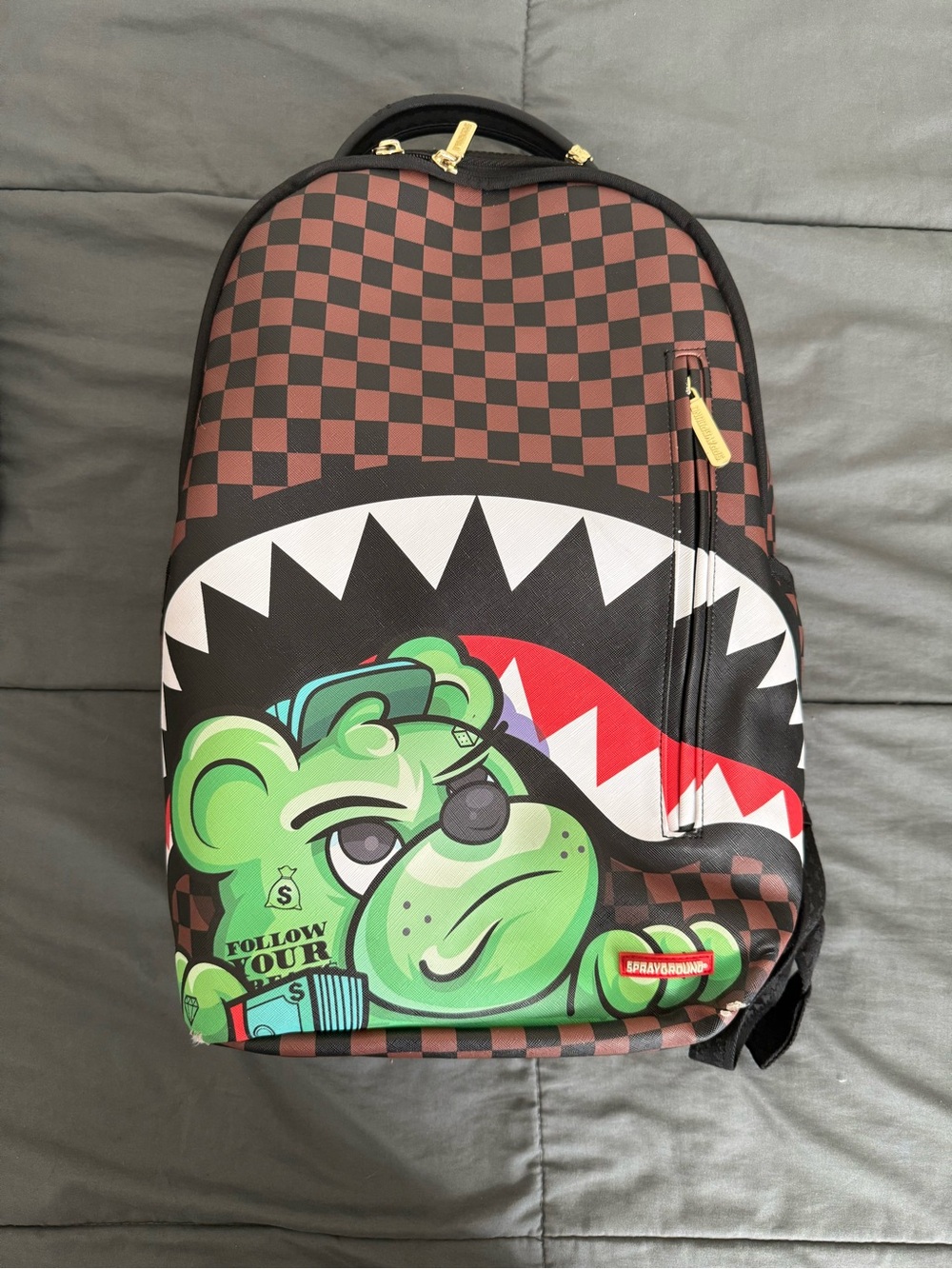 Sprayground Brown Checkered Backpack with Green Bear Graphic